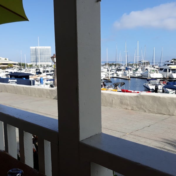Photo taken at Buster&#39;s Beachhouse Grill &amp; Longboard Bar by Eric V. on 6/13/2019