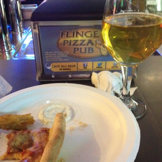Photo taken at Flingers Pizza Pub by Julie K. on 10/27/2012