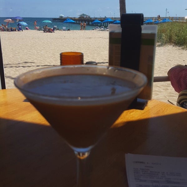 Photo taken at Aruba Beach Cafe by T. T. on 10/16/2019