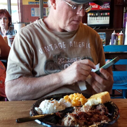 Photo taken at VooDoo BBQ &amp; Grill Uptown by Jeremy L. on 7/30/2014