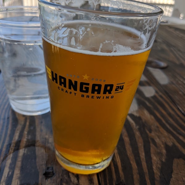 Photo taken at Hangar 24 Craft Brewery by Angel G. on 6/12/2019