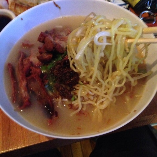 Photo taken at Foo Dog: Asian Street Food by M C. on 5/23/2014