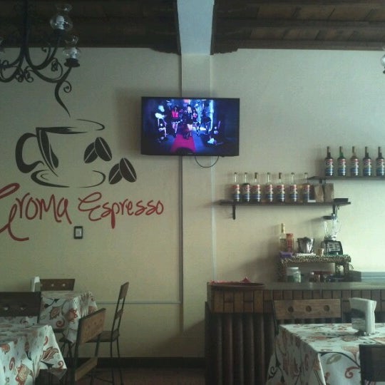 Photo taken at Aroma Espresso Café by Rodrigo M. on 1/9/2013