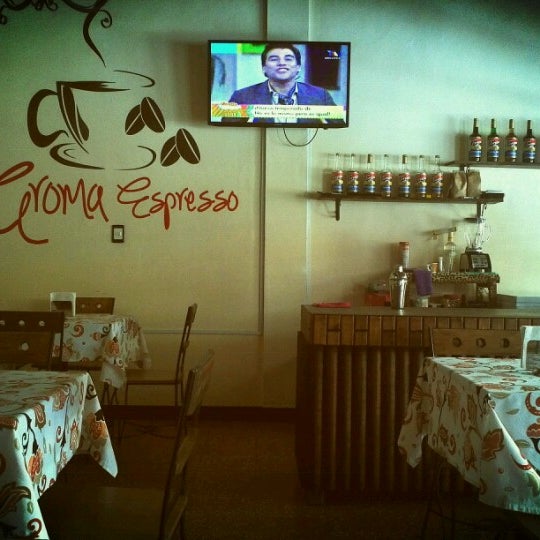 Photo taken at Aroma Espresso Café by Rodrigo M. on 1/10/2013