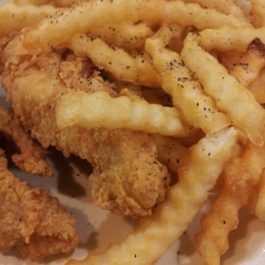 Photo taken at Raising Cane&#39;s Chicken Fingers by Emmanuel L. on 12/15/2012