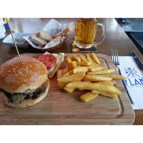 Photo taken at Flame Burger &amp; Steak House by Esra G. on 10/25/2014