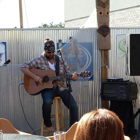 Photo taken at Gilligan&#39;s Tropical Bar &amp; Grill by Dave B. on 5/7/2013
