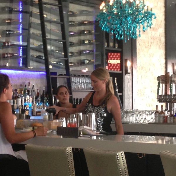Photo taken at Encore Champagne Bar &amp; Dining Room by Chrissa C. on 7/24/2014