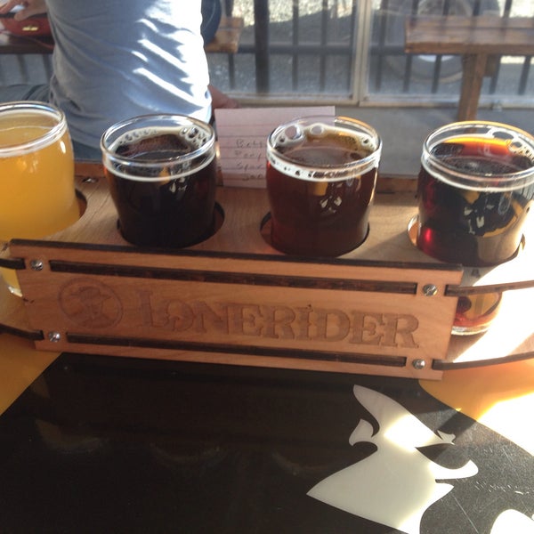 Photo taken at Lonerider Brewing Company by Andrew S. on 1/25/2015