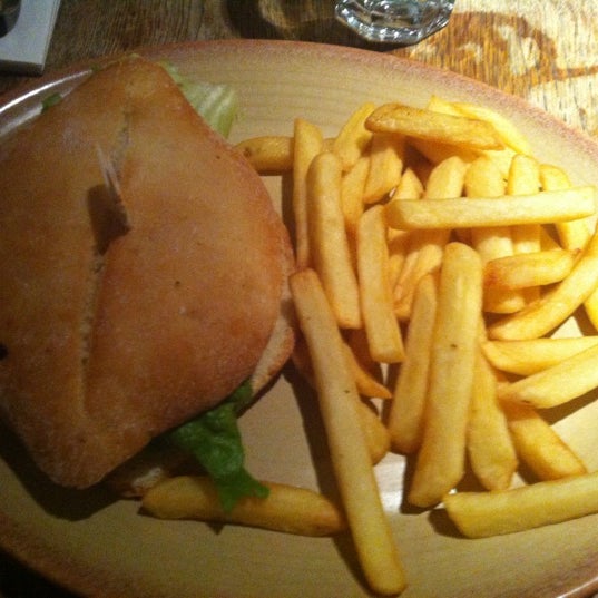 Photo taken at Nando&#39;s by Katie S. on 12/23/2012