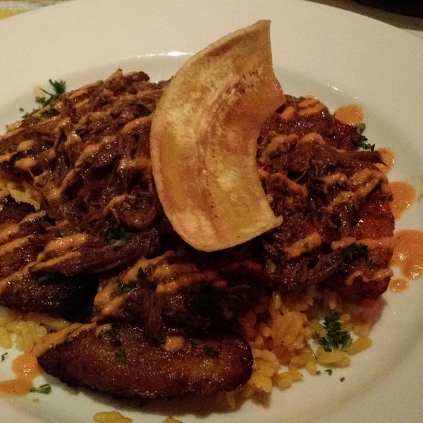 The ropa vieja is amazing. Great rum cocktails. Sit at the bar area with the same menu if you don't have reservations.