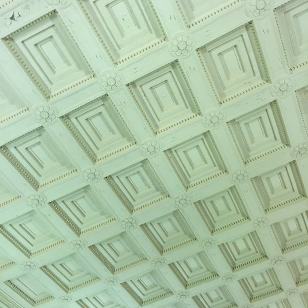 The two-story ornate ceiling of the old bank in the hotel lobby is beautiful.