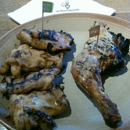 Photo taken at Nando&#39;s by Justina W. on 10/22/2015