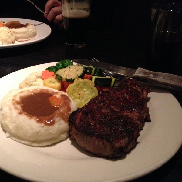Photo taken at Stubrik&#39;s Steakhouse by Thida P. on 4/18/2013