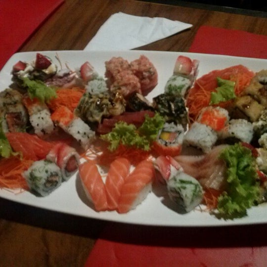 Photo taken at Sensei Lounge Sushi by Thayna R. on 12/24/2012