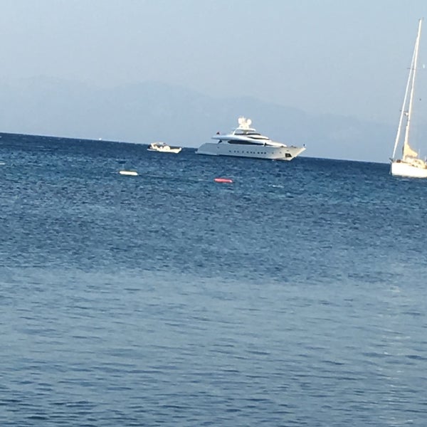 Photo taken at Poseidon Beach Club by Şule T. on 8/15/2017