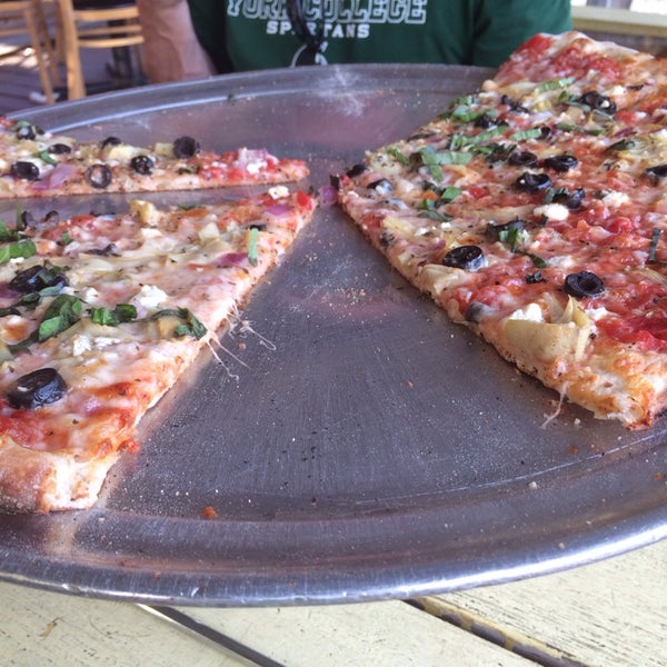 Photo taken at Salvation Pizza - 34th Street by Amy C. on 8/10/2014