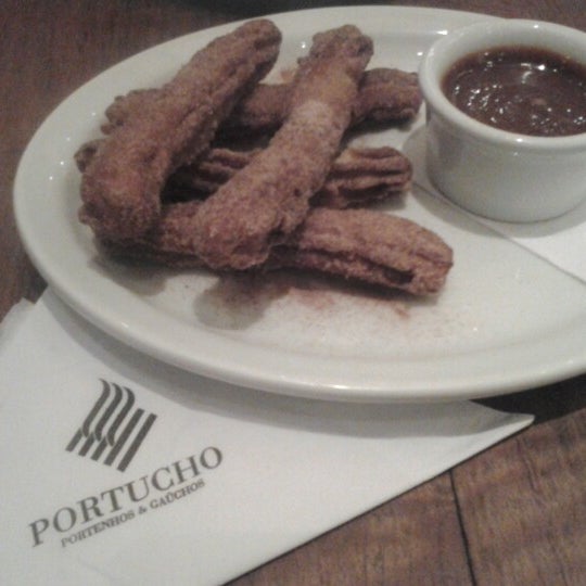 Photo taken at Portucho by Claudia K. on 2/1/2013