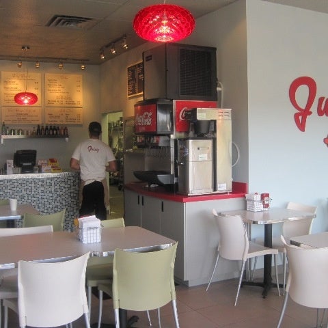 Juicy Burgers & Dogs is located in a modern, minimalist, stark-white space wedged into the corner of a small strip mall in Centennial.