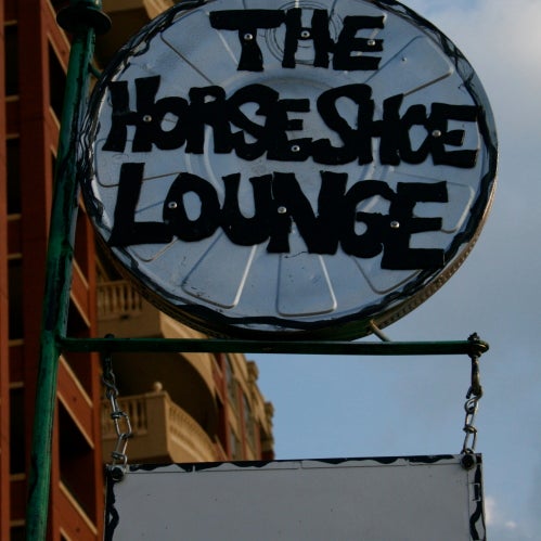 Outfitted with booths, couches, comfy chairs, a pool table, a dartboard and a big-screen TV, the Horseshoe Lounge feels like walking into someone's living room or rec room.