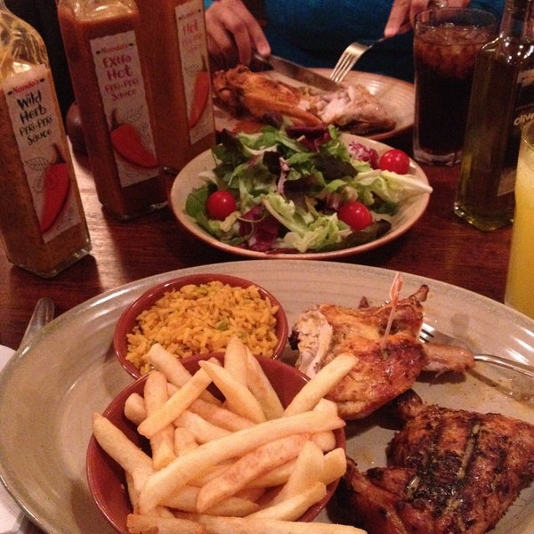 Photo taken at Nando&#39;s by Grover B. on 7/4/2013