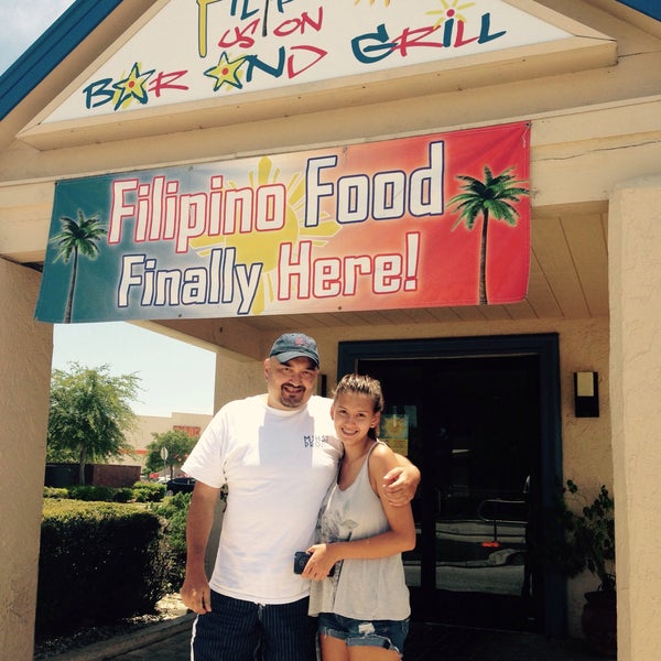 Photo taken at Filipino Fusion Bar &amp; Grill by Stephanie V. on 7/4/2015