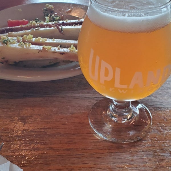 Photo taken at Upland Brewing Company Brew Pub by Jeff G. on 9/11/2020