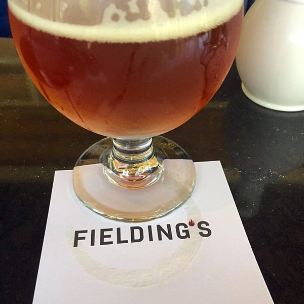 Photo taken at Fielding&#39;s local kitchen + bar by Crispin G. on 8/9/2015