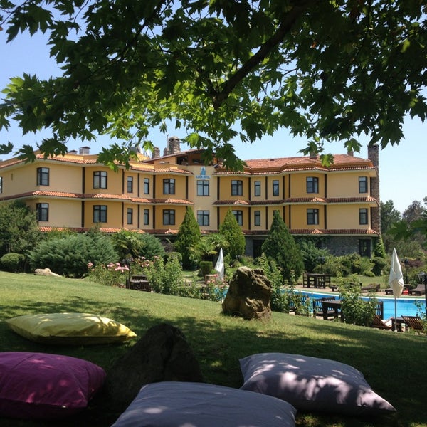 Photo taken at Iliada Hotel by Uğur S. on 7/21/2013