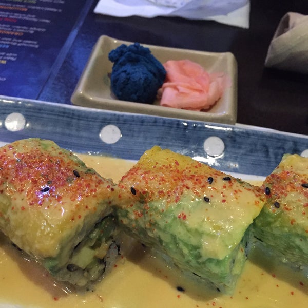 Photo taken at Blue Wasabi Sushi &amp; Martini Bar by Luis M. on 4/4/2015