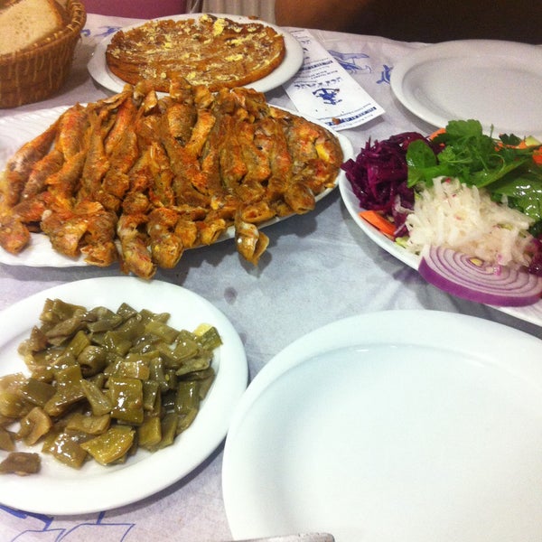 Photo taken at Kıyak Kardeşler Balık Restaurant by Ahmet T. on 3/29/2015