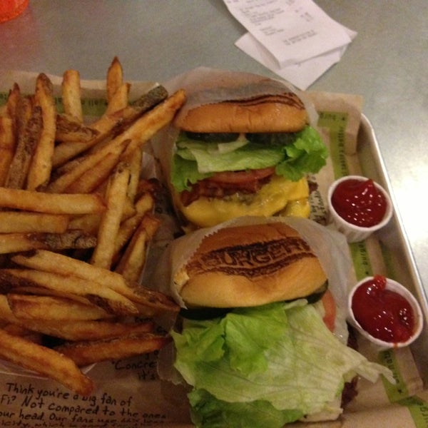 Photo taken at BurgerFi by Glow I. on 2/14/2013