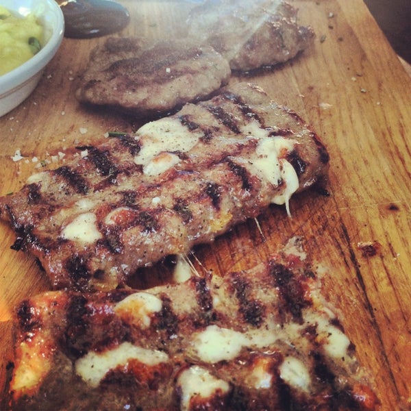 Photo taken at Flame Burger &amp; Steak House by Derya T. on 7/20/2013