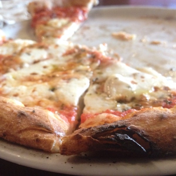The open-flame, brick oven adds an incredible smoky char flavor to the wonderfully chewy, delicious thin crust. An authentic Neapolitan pizza for a great price. Can't go wrong.