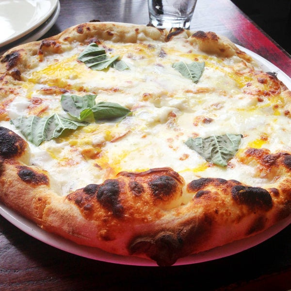 Try pizza punch of awesomeness, Sugo White Pizza $14 (6/5 NOMs). One of the best white sauce pizzas in the area. Ask to add some fun toppings like an egg :)