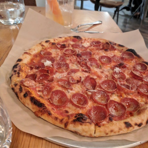 Photo taken at Brezza Cucina + Pizzeria by Allie U. on 1/12/2019