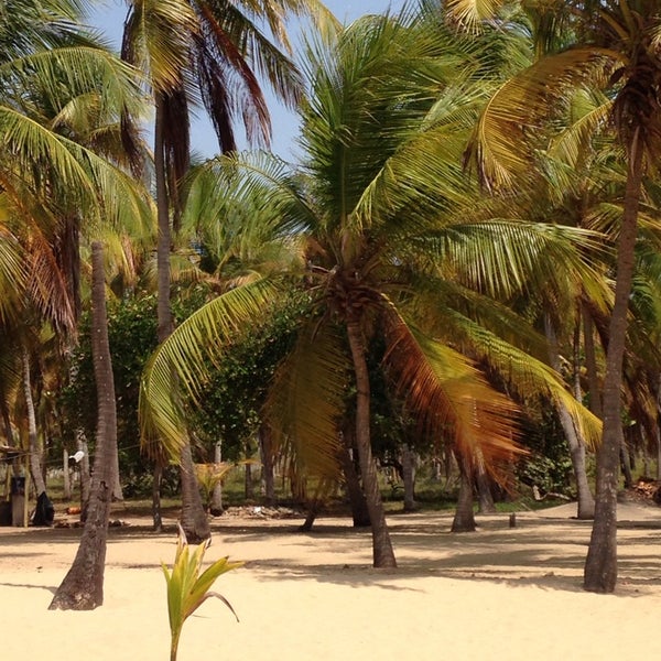 Photo taken at Playa de Boca de Uchire by Aracelis M. on 3/23/2014