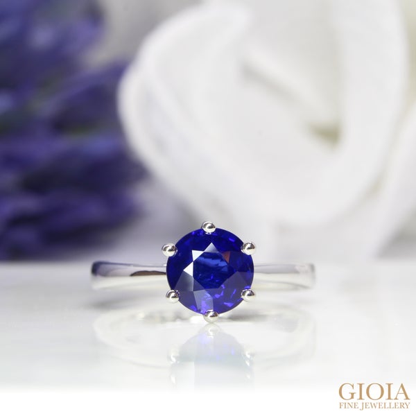 Vivid Blue Sapphire Solitaire Ring Featuring a round vivid blue sapphire designed with six prongs and handcrafted in platinum to last a lifetime.