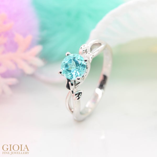 Paraiba Tourmaline Engagement Ring Natural floral leaves inspired design surrounding the round brilliant paraiba tourmaline with twisted ring. Congratulation to Bryan & Gladys!