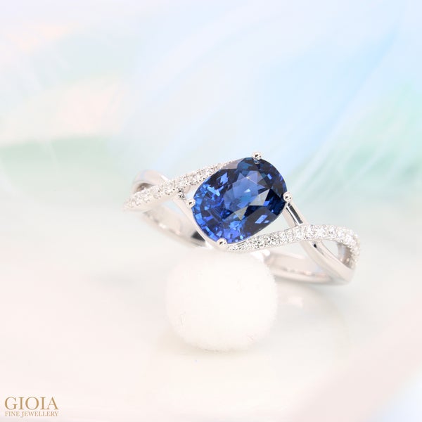 Sapphire Engagement Ring Featuring an unheated vivid Royal Blue Sapphire. Charmingly intricate twisted micro-pave diamond design in white gold.