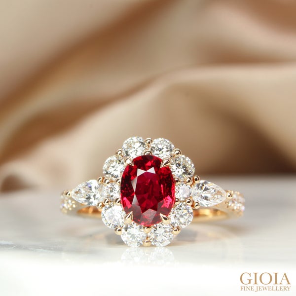 Ruby Halo Diamond Engagement Ring Featuring a vivid unheated Pigeonblood Ruby, crafted in rose gold band.