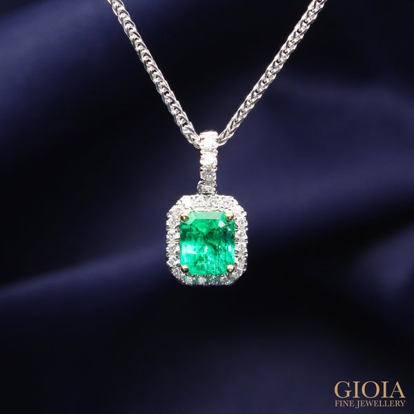 Emerald Pendant Jewellery Vibrant green Colombian emerald with minor oil, customised to an elegant statement jewellery, set in fine yellow gold claw with halo micro pave diamond.