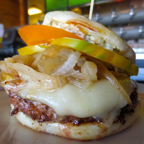 Weekly special: The OKC Burger! Signature burger patty with caramelized onions, caper aioli, heirloom tomato and Monterey Jack cheese, served on a toasted english muffin.