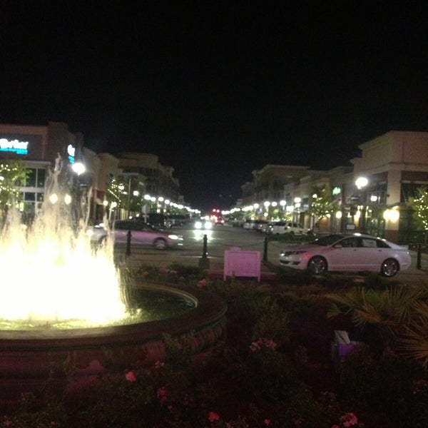 Photo taken at Mayfaire Town Center by Thomas Y. on 9/2/2013