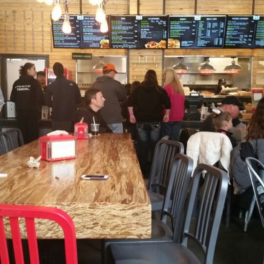 Photo taken at BurgerFi by Jack D. on 3/28/2015