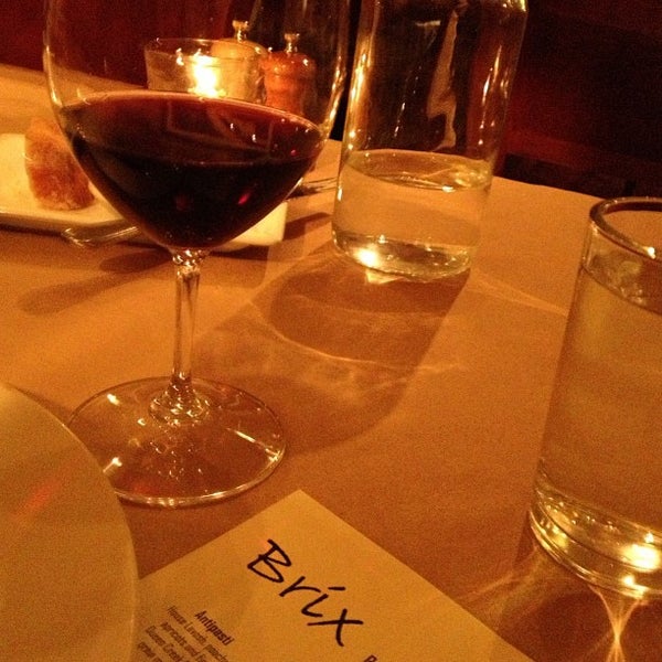 Photo taken at Brix Restaurant and Wine Bar by Nicole H. on 4/6/2013