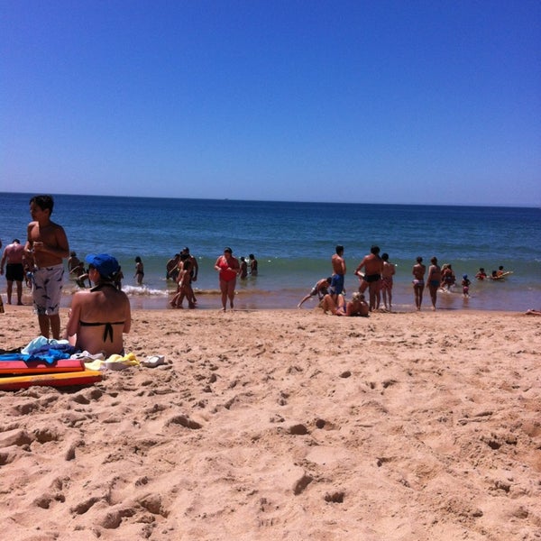 Photo taken at Praia dos Gémeos by olga m. on 8/8/2013