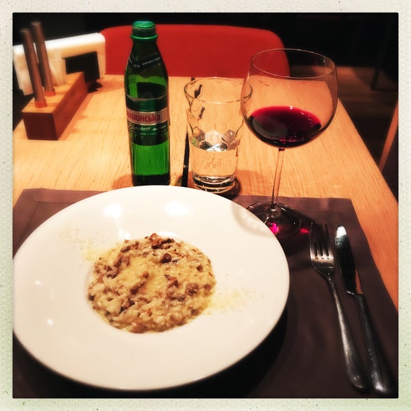 Mushroom risotto with a glass of Merlot.