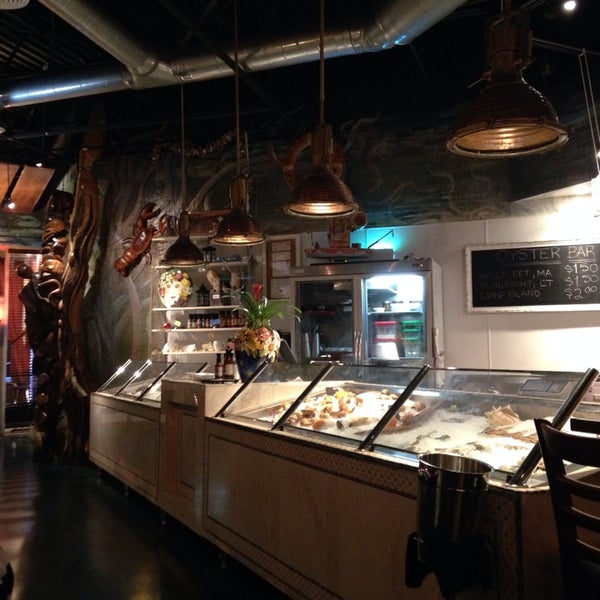 Photo taken at Fish Fish Restaurant, Bar, &amp; Market by Elena D. on 1/6/2014