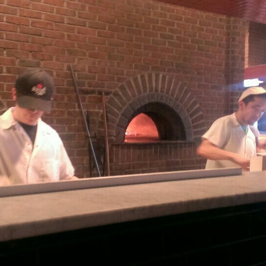Photo taken at Rocco&#39;s Wood Fired Pizza by Kate on 6/27/2015
